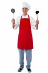 Chef Holding Kitchen Essentials Stock Photo