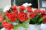 Bouquet Of Roses In Pots With White Table For Valentines Day Stock Photo