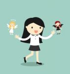 Business Concept, Business Woman With Angel And Devil Stock Photo
