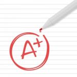 A Plus Grade On Line Paper With Red Pen Stock Photo