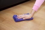 Woman's Hand Cleaning The Floor With A Floorcloth Stock Photo