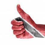 Flag Of Trinidad And Tobago On Thumb Up Hand Stock Photo