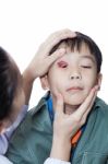 Pinkeye (conjunctivitis) Infection On A Boy, Doctor Check Up Eye Patient. Studio Shot Stock Photo