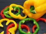 Fresh Vegetables, Red, Yellow, Green Sweet Peppers On Dark Wood Stock Photo