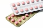 Pink Pills In Silver And Gold Strips Stock Photo