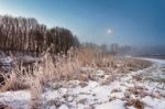 Moonlight In The Winter Dawn. Fog And Mist On Snowy Winter River Stock Photo