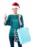 Smiling Woman Shopping For Christmas Stock Photo