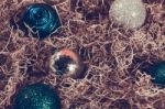 Christmas Ornaments In Hay Stock Photo