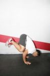 Hispanic Man Acrobatics Gymnastic Doing A Exercise Gym, Athletic Stock Photo
