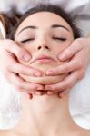 Woman Enjoying Massage At Beauty Spa Stock Photo