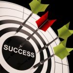 Success On Dartboard Shows Successful Goals Stock Photo
