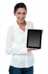 Saleswoman Displaying New Touch Pad Device Stock Photo