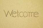 Welcome Written On Sand Stock Photo