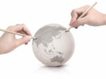 Two Hand Shade Drawing Asia Map On Paper Ball Stock Photo