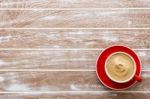 Red Cup Of Coffee On Wood Background Stock Photo