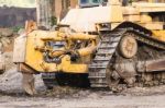 A Large  Bulldozer In Construction Site Stock Photo