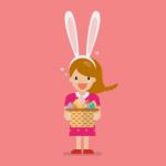 Girl With Bunny Ears Mask Holding Basket Full Of Easter Eggs Stock Photo