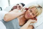 Young Woman Who Can Not Sleep Because Her Husband Snores Stock Photo