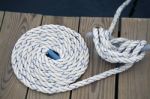 White Rope With Mooring Bollard Stock Photo