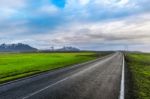 A Long Straight Road And Blue Sky Stock Photo