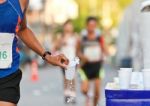 Marathon Racer Holing Cup Of Water Stock Photo