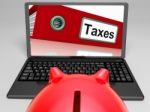 Taxes File On Laptop Shows Taxation Stock Photo