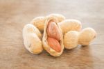 Salted Peanuts On Weathered Wood Stock Photo