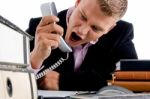 Angry Manager Shouting On Phone Stock Photo