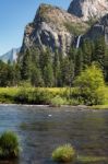 Waterfall And The Merced River  In Yosemite On A Summer's Day Stock Photo