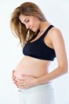Beautiful Pregnant Woman. Isolated Over A White Background Stock Photo