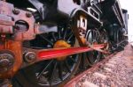 Iron Wheels Of Stream Engine Locomotive Train On Railways Track Stock Photo