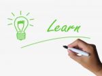 Learn And Lightbulb Means Training And Learning Skills Or Knowle Stock Photo