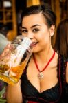Girl Drinking Beer At Oktoberfest Stock Photo