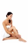 Attractive Woman Massaging Her Leg Stock Photo