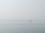 Horizontal Sparse Pale Lonely Ship In White Ocean Background Bac Stock Photo