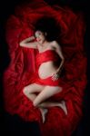 Glamour And Style Of Beautiful Young Asian Pregnant Woman Laying Stock Photo