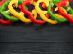 Fresh Vegetables, Red, Yellow, Green Sweet Peppers On Dark Wood Stock Photo