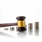 Judges Law Gavel With Coins Stock Photo