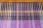 Detail Of Fabric In Comb Loom With Ultraviolet And Lilac Colors Stock Photo