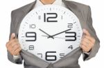 Businessman Showing Clock In Suit Stock Photo