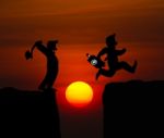 Concept Cartoon Silhouette, Man Hold Axe And  Man Jumping Over P Stock Photo