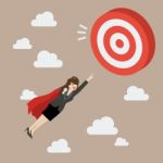 Business Woman Super Hero Fly To Big Target Stock Photo