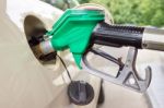 Pistol Grip Filling Car Tank With Gasoline Stock Photo