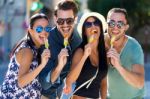 Portrait Of Group Of Friends Eating Ice Cream Stock Photo