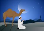 Man Praying And Camel With Full Moon Background Stock Photo