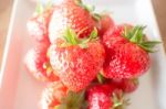 Fresh Ripe Strawberries On White Plate Stock Photo