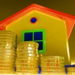 Coins Around House Showing Paying Rent Stock Photo