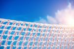 Frozen And Snow Covered Protective Net On Skiing Track. Concept Of Winter Stock Photo