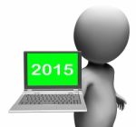 Two Thousand And Fifteen Character And Laptop Shows New Year 201 Stock Photo