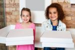 Kids Holding Pizza Boxes Stock Photo